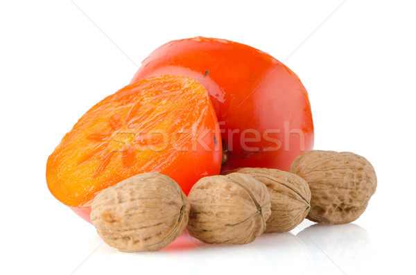 Stock photo: Ripe persimmons and nuts