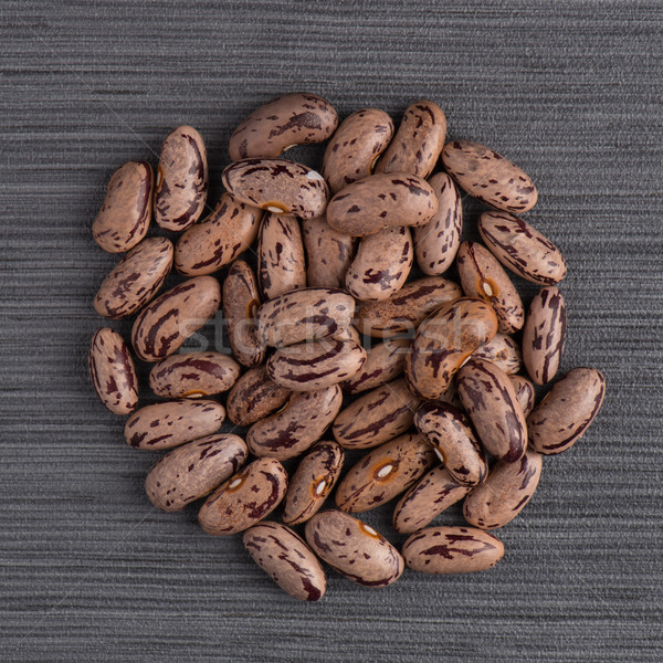 Circle of pinto beans Stock photo © homydesign