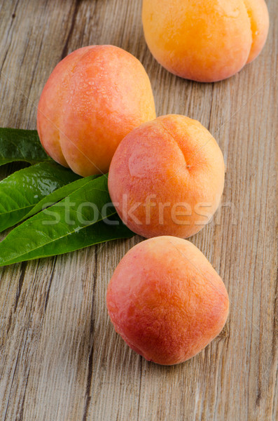Apricots with leaves Stock photo © homydesign