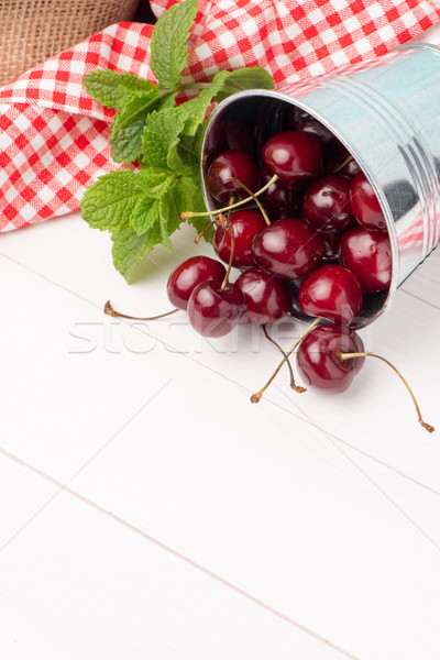 Cherries in small metal bucket Stock photo © homydesign
