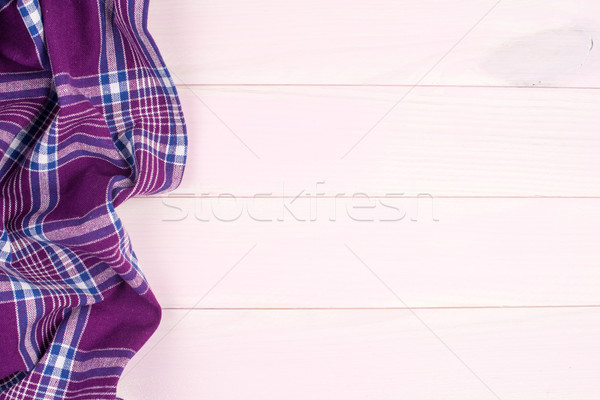 Purple towel over wooden table Stock photo © homydesign