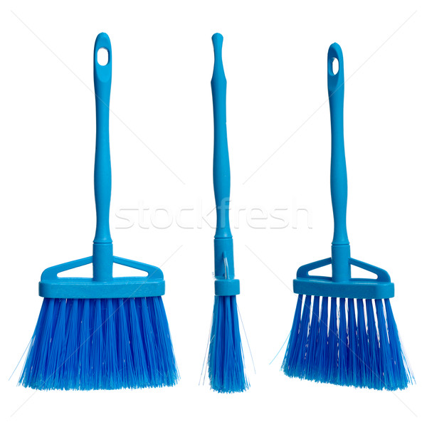 Three plasticblue brooms Stock photo © homydesign