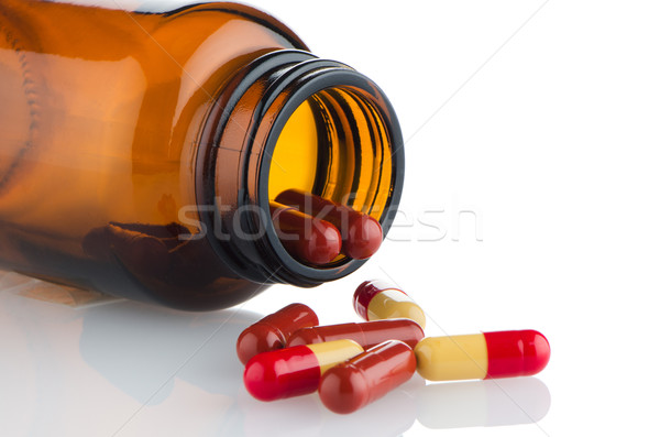 Pills from bottle Stock photo © homydesign