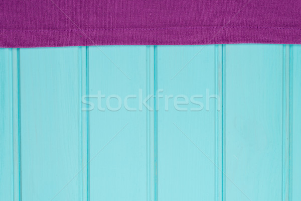 Purple towel over wooden table Stock photo © homydesign