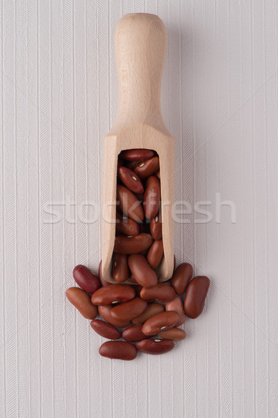 Wooden scoop with red beans Stock photo © homydesign