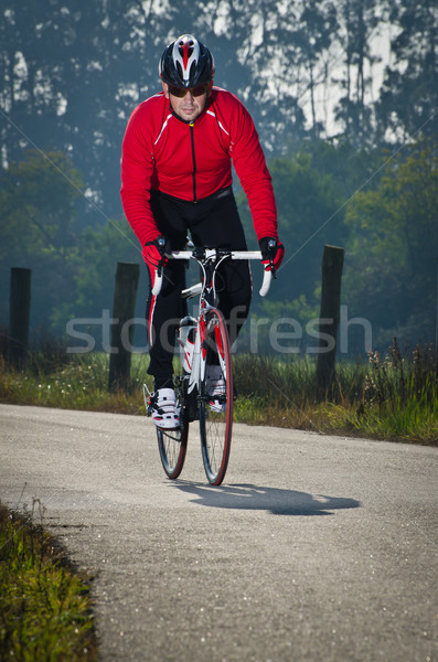 Ciclista hombre carretera moto equitación abajo Foto stock © homydesign