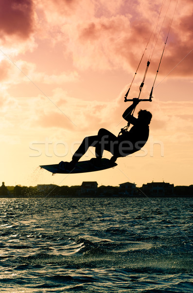 Silhouette of a kitesurfer flying Stock photo © homydesign