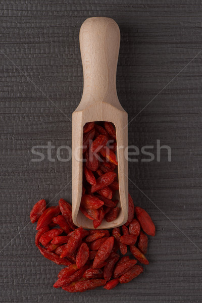 Wooden scoop with dry red goji berries Stock photo © homydesign