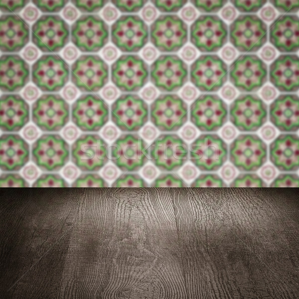 Stock photo: Wood table top and blur vintage ceramic tile pattern wall