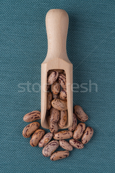 Wooden scoop with pinto beans Stock photo © homydesign