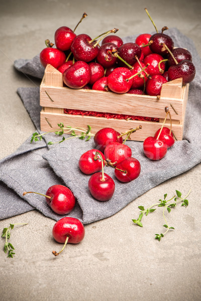 Red ripe cherries in small wooden box Stock photo © homydesign