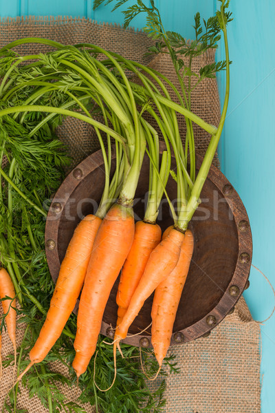 Carrots on a wooden table Stock photo © homydesign