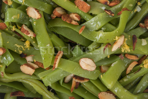 Green beans with roasted almonds Stock photo © homydesign
