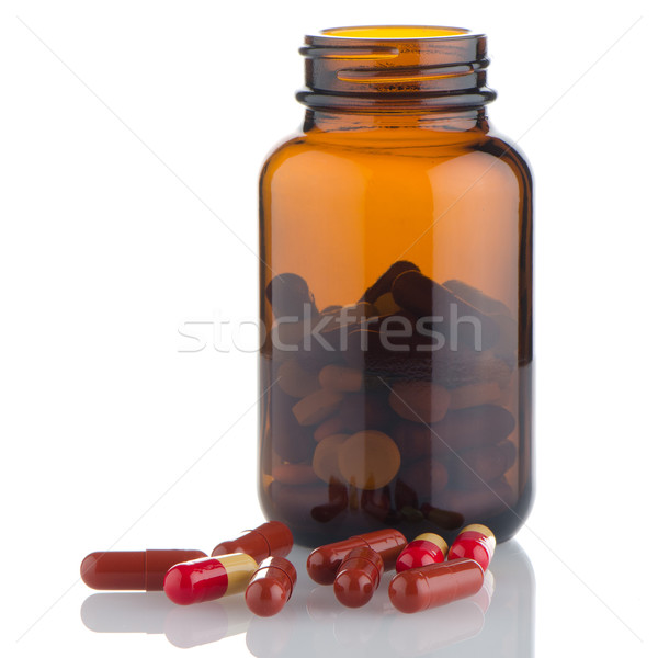 Pills from bottle Stock photo © homydesign