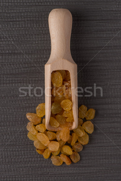 Holz schöpfen golden Rosinen top Ansicht Stock foto © homydesign
