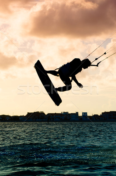 Silhouette of a kitesurfer flying Stock photo © homydesign