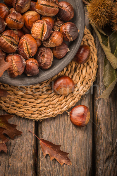 Stock photo: Roasted chestnuts and leaves