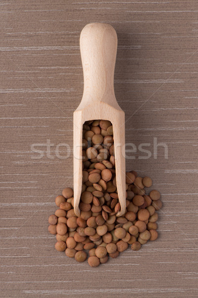 Wooden scoop with lentils Stock photo © homydesign