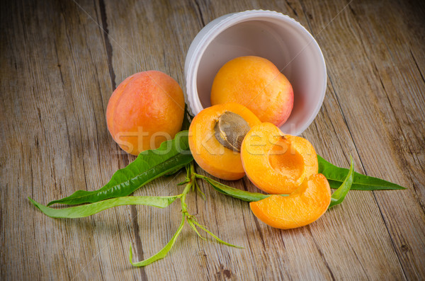 деревянный стол белый керамической чаши фрукты оранжевый Сток-фото © homydesign