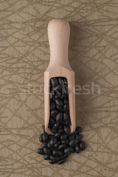 Wooden scoop with black beans Stock photo © homydesign
