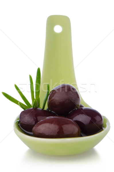 Olives on ceramic spoon Stock photo © homydesign