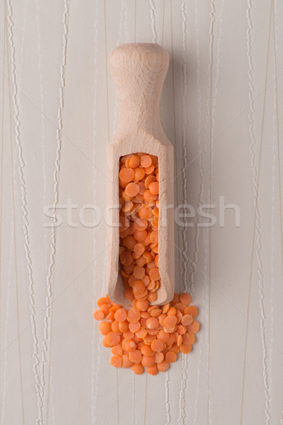 Wooden scoop with  peeled lentils Stock photo © homydesign