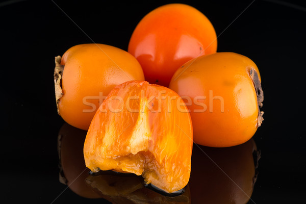 Persimmon vruchten zwarte voedsel natuur vruchten Stockfoto © homydesign