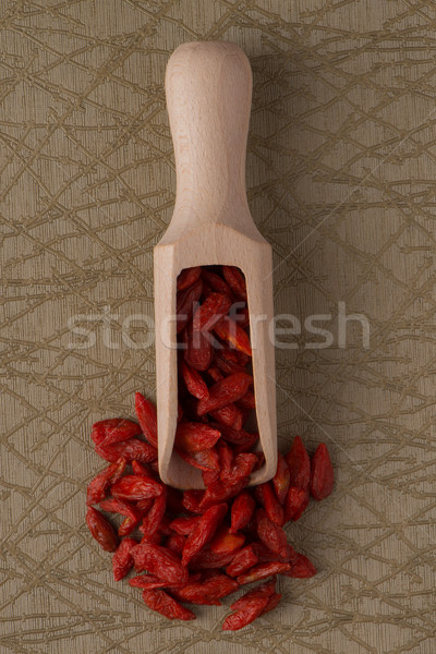 Wooden scoop with dry red goji berries Stock photo © homydesign