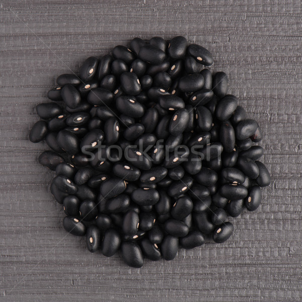 Circle of black beans Stock photo © homydesign