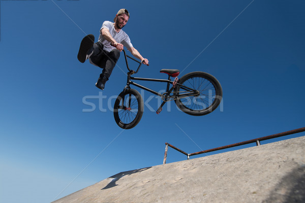 BMX Bike Stunt tail whip Stock photo © homydesign