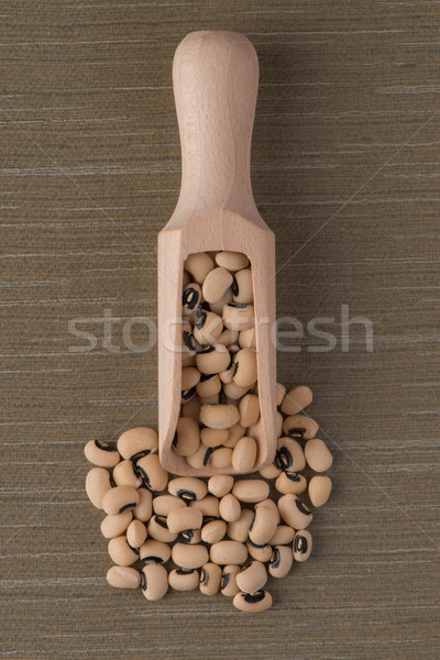 Wooden scoop with white beans Stock photo © homydesign