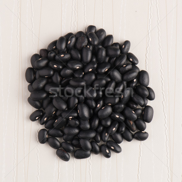Circle of black beans Stock photo © homydesign