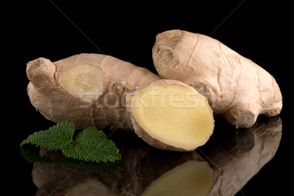 Ginger root on black Stock photo © homydesign