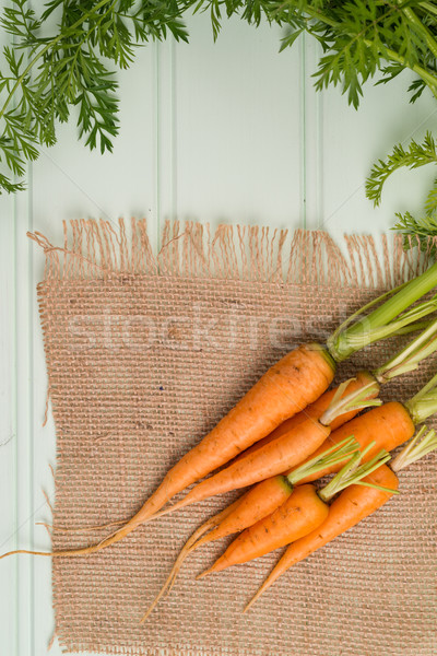 Carrots on wooden table Stock photo © homydesign