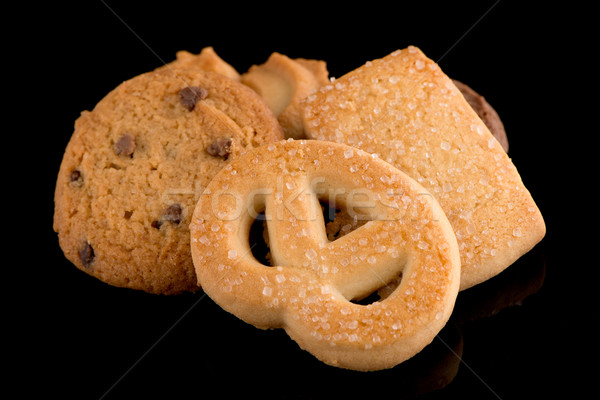 Butter cookies on black Stock photo © homydesign