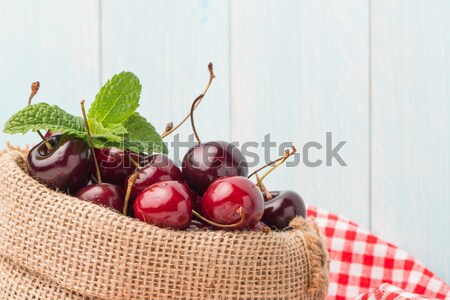 Cherries in small bag Stock photo © homydesign