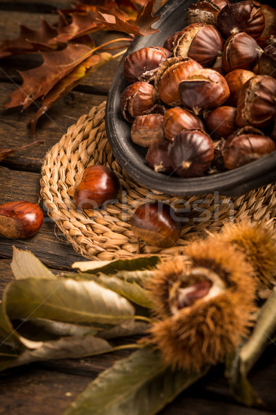 Roasted chestnuts and leaves Stock photo © homydesign