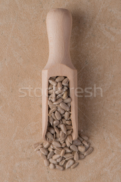Wooden scoop with shelled sunflower seeds Stock photo © homydesign