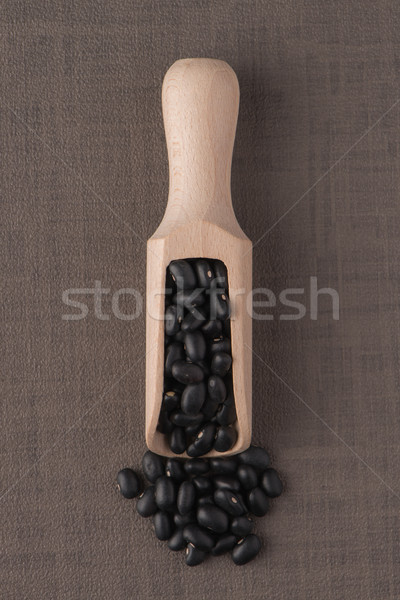 Wooden scoop with black beans Stock photo © homydesign