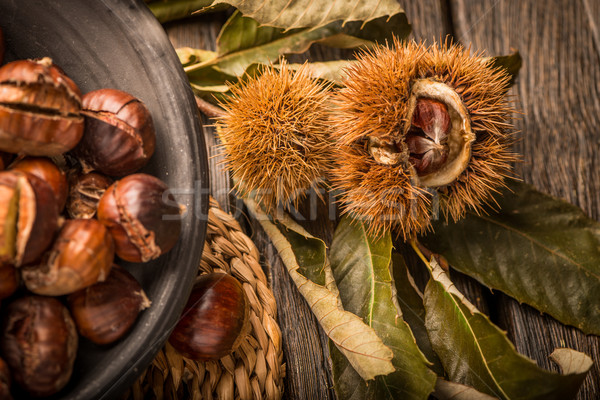 Roasted chestnuts and leaves Stock photo © homydesign