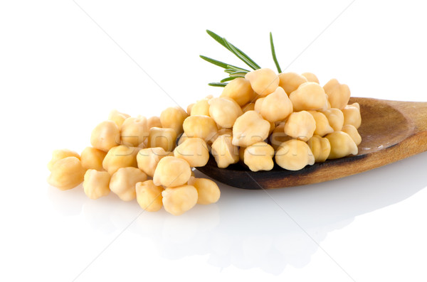 Chickpeas over wooden spoon Stock photo © homydesign