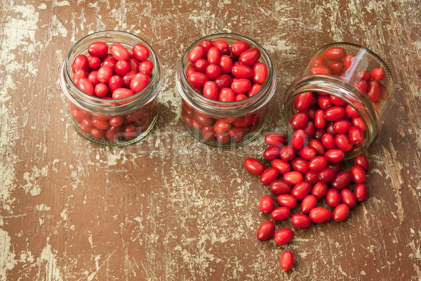 Ripe cornelian cherry in glass jars  Stock photo © hraska