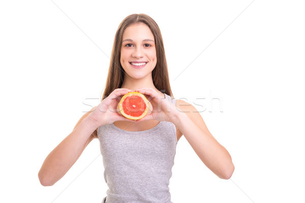 Eszik több gyümölcs fiatal nő tart friss Stock fotó © hsfelix