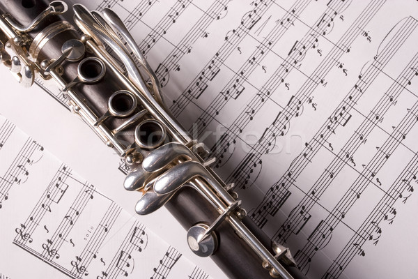 Clarinet isolated over sheet music Stock photo © hsfelix
