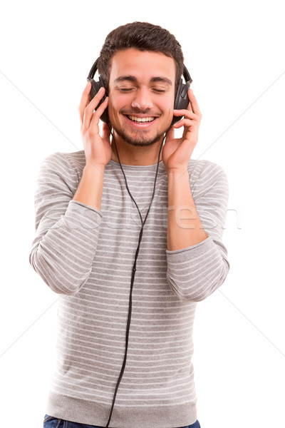 Hombre escuchar música feliz joven auriculares moda Foto stock © hsfelix