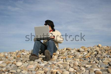 Young Man Holding White Card at the beach Stock photo © hsfelix