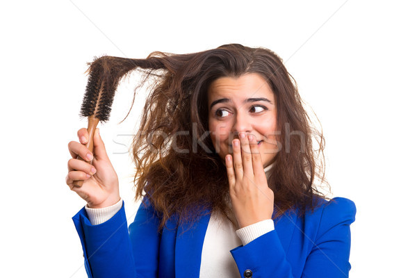 Woman taking care of her hair Stock photo © hsfelix
