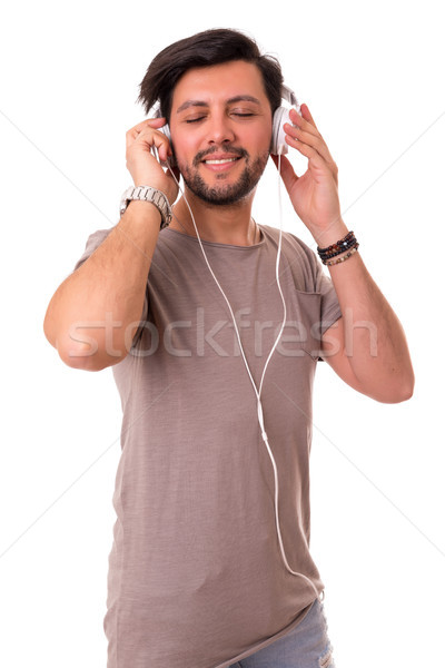 Hombre escuchar música feliz joven auriculares música Foto stock © hsfelix