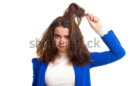 Stock photo: Woman taking care of her hair