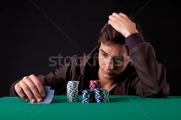 Homme jeunes bel homme jouer Texas argent [[stock_photo]] © hsfelix